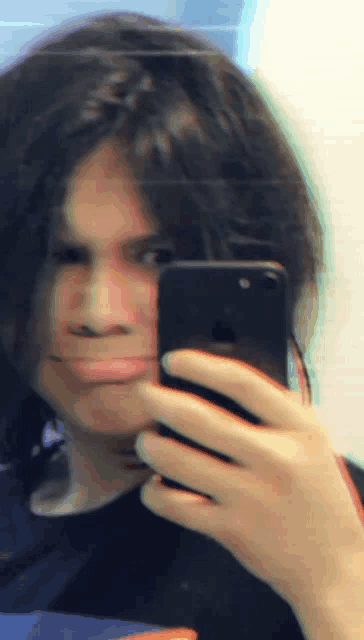 a person is taking a selfie with their iphone