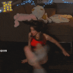 a woman is doing sit ups in front of a couch with the number 10119 on the bottom