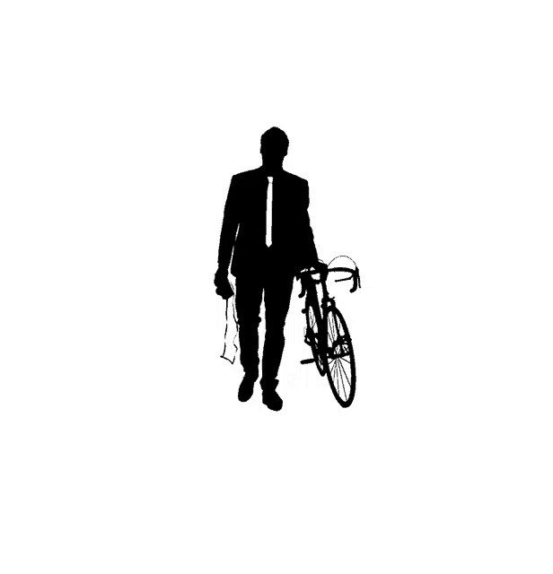 a man in a suit and tie carrying a bicycle