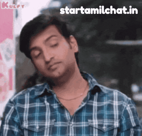 a man wearing a plaid shirt is making a funny face with the words starttamilchat.in written below him