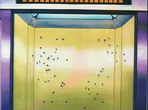 an elevator with bullet holes in the wall