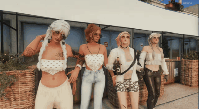four women are standing in front of a building with a sign that says ' no smoking ' on it