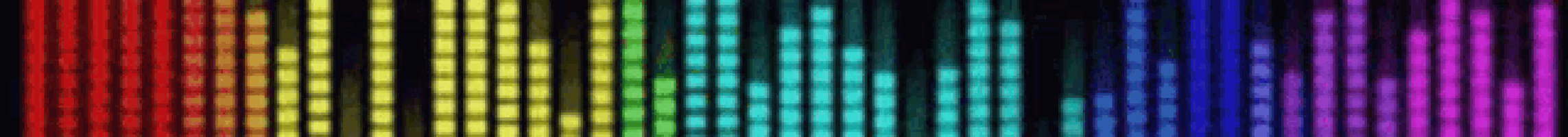 a rainbow of colorful lights on a black background .