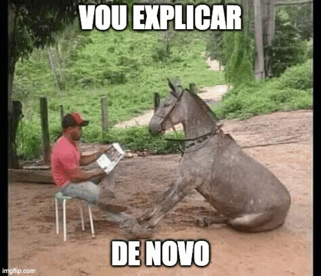 a man is sitting on a stool reading a book while a donkey is sitting next to him .