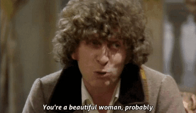 a man with curly hair says " you 're a beautiful woman "