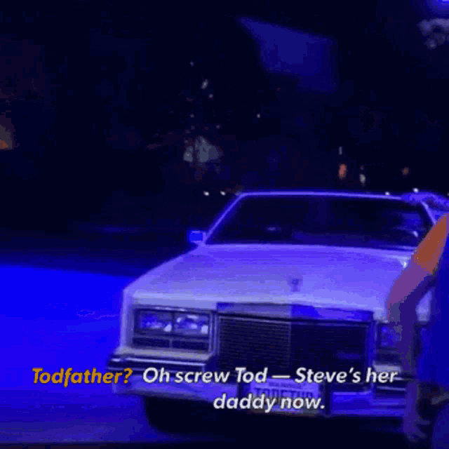a white car with a license plate that says tod father