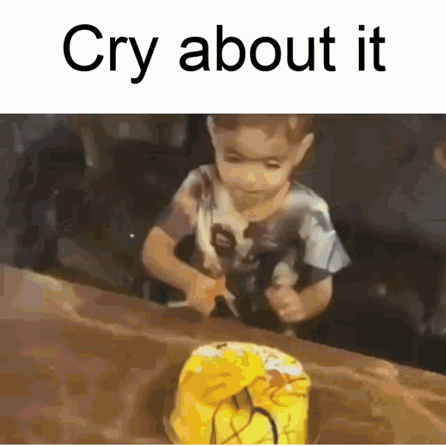 a little boy is cutting a yellow cake with the words cry about it written above him