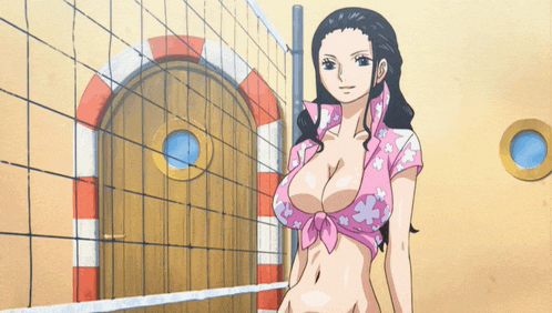 a woman in a pink top is standing next to a volleyball net