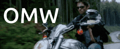 a man is riding a motorcycle on a road with the word omw written above him