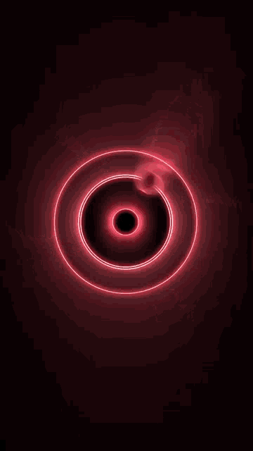 a red circle with a black eye in the middle