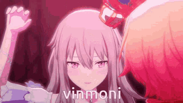 a close up of a pink anime girl with the words vinmoni written on it .
