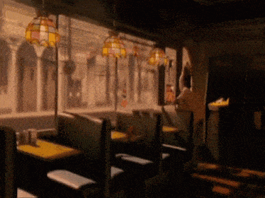 a diner with tables and booths and a sign that says ' a ' on it