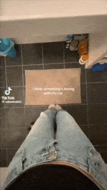 a tiktok video of a person standing on a tile floor