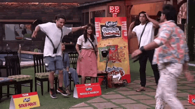 a group of people are playing a game with a sign that says solid masti