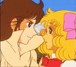 a boy and a girl are looking at each other