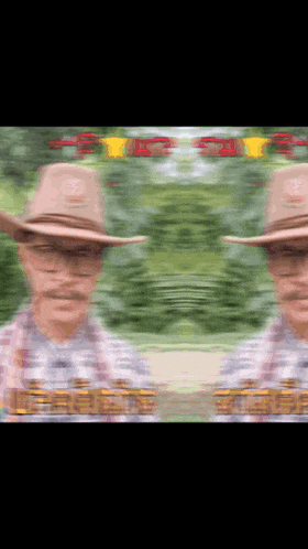 a blurry picture of a man wearing a cowboy hat and glasses