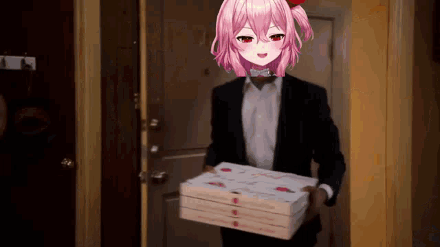 a man in a suit and bow tie is carrying a stack of pizza boxes .