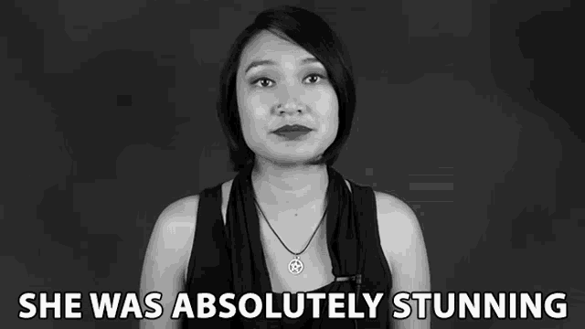a black and white photo of a woman with the words she was absolutely stunning below her