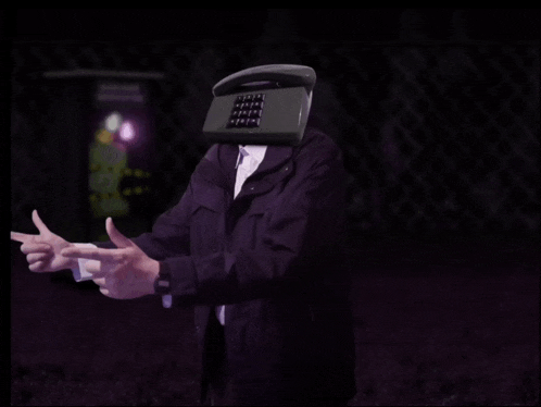 a man with a telephone in front of his head