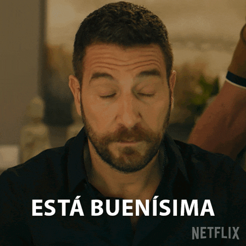a man with his eyes closed says " esta buensima " on a netflix ad