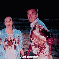 a man and a woman are standing next to each other and the man is covered in blood and the woman is saying act casual