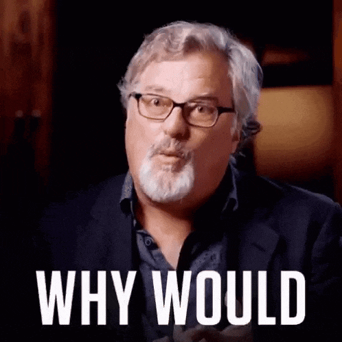 a man with glasses and a beard is looking at the camera and says `` why would '' .