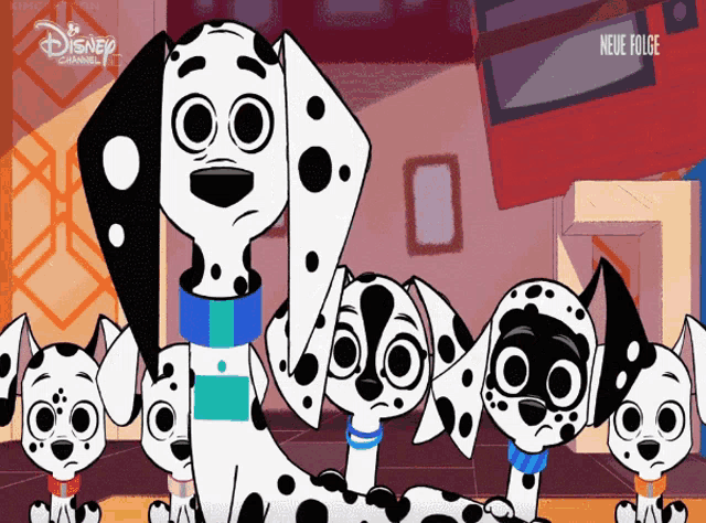 a group of dalmatian dogs standing next to each other on a disney channel ad