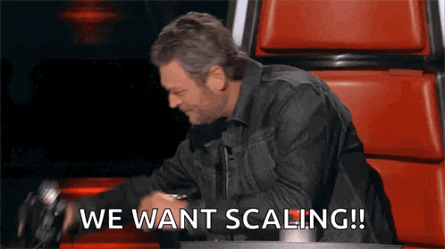 a man sitting in a chair with the words " we want scaling " written on the bottom