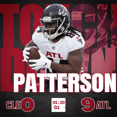 a football player named patterson is holding a football in his hands