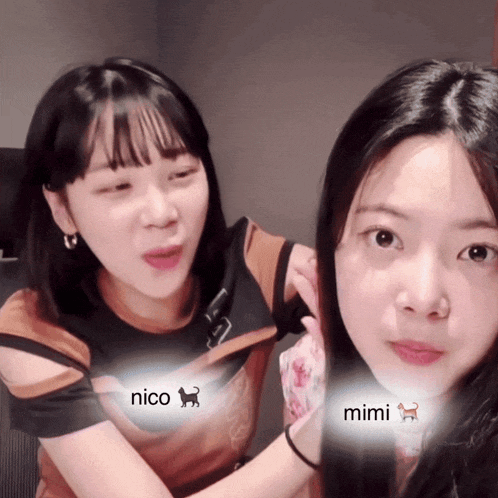 two girls are sitting next to each other with nico and mimi written on their chests