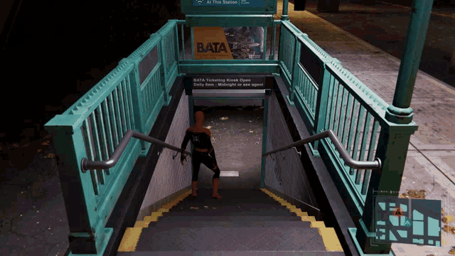 a man in a spiderman costume is standing on a set of stairs in front of a sign that says bata