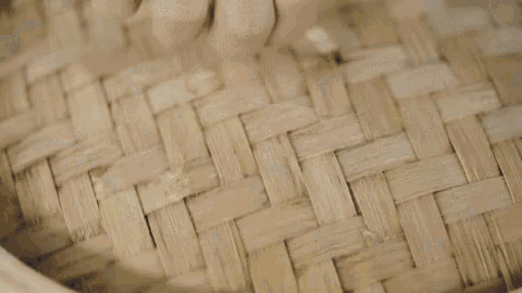a close up of a bunch of dumplings being cooked in a pan with steam coming out of them .