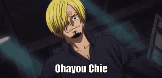 a man with blonde hair and a beard is wearing a black shirt and says ohayou chie