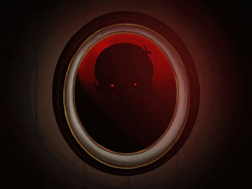 a picture frame with a silhouette of a person with red eyes in it