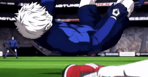 a soccer player is falling through the air while playing soccer on a field .