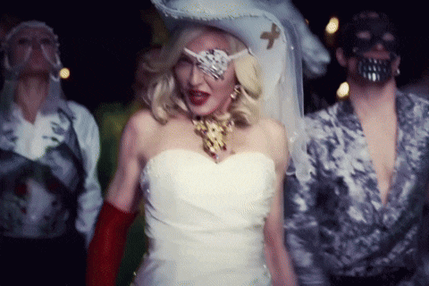 a woman in a white dress is wearing a pirate hat and eye patch