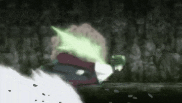 a person is running in a dark room with a green light coming out of their mouth .
