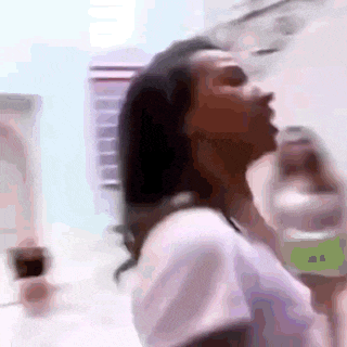 a blurry picture of a woman drinking water