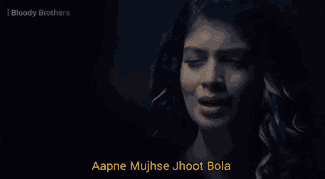 a woman wearing glasses and a green jacket says " aapne mujhse jhoot bola "
