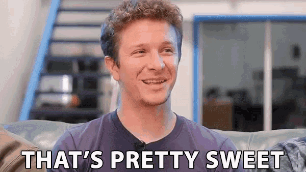 a man is sitting on a couch with the words that 's pretty sweet behind him