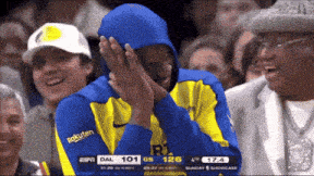 a basketball player wearing a blue hoodie with rakuten written on it