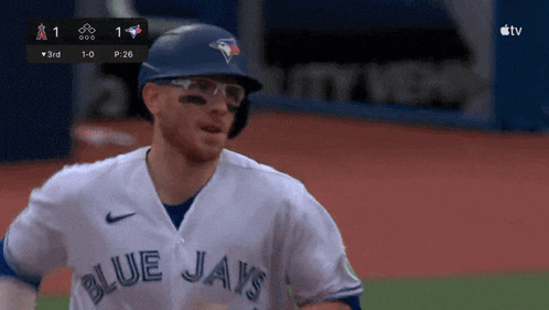 a baseball player wearing a blue jays uniform