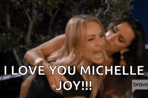 two women are hugging each other and one is saying `` i love you michelle joy '' .