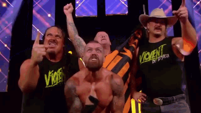 a group of men are standing next to each other and one of them is wearing a shirt that says violent by design .