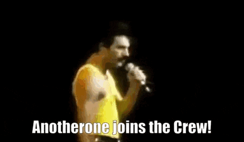 a man in a yellow shirt is singing into a microphone and saying `` anotherone joins the crew '' .