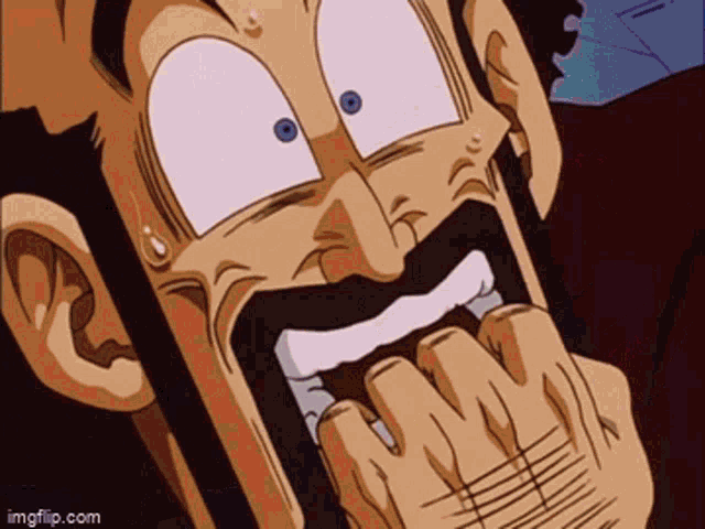 a close up of a man 's face with his mouth open
