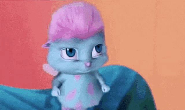 a cartoon character with pink hair and blue eyes is sitting on a blue cloth .