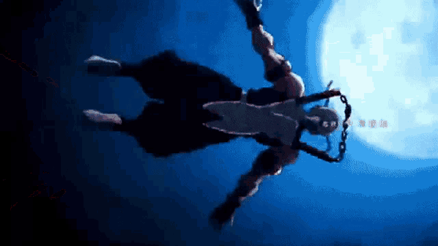 a man with a chain around his neck is flying through the air