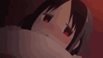 a cartoon character with red eyes is laying down