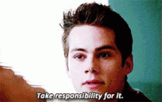 a close up of a man 's face with the words `` take responsibility for it '' written on it .